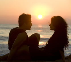 Photo of Couple Watching a Sunset